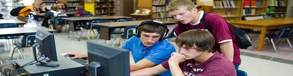 Teenagers using computers